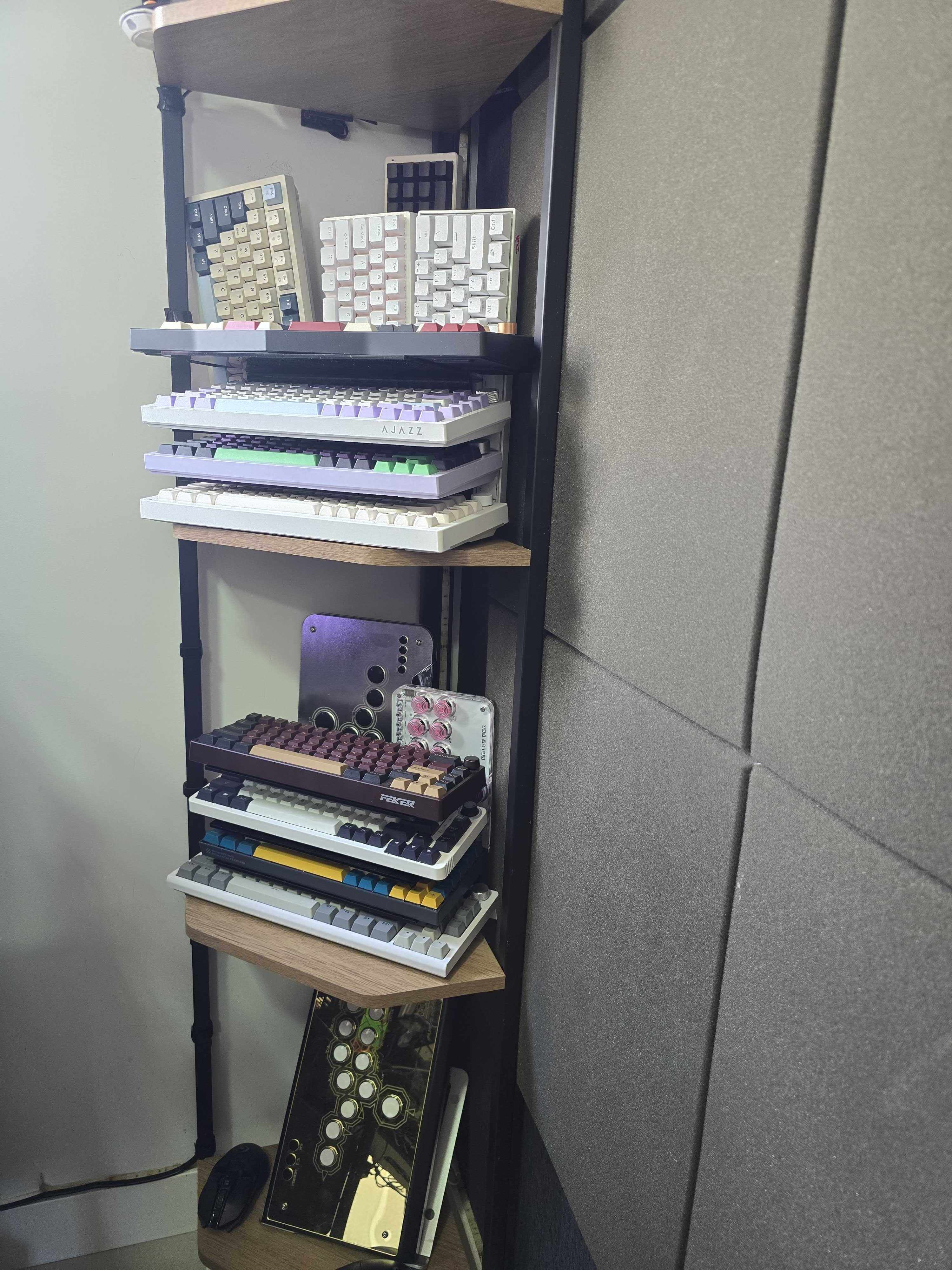 A stack of keyboards on a shelf