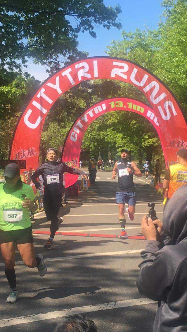 Morten crossing the finish line of a 10 km run